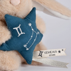 Histoire d'Ours Gemini zodiac plush toy accessory, teal star with embroidered constellation and Gemeaux label, held by cream bunny toy