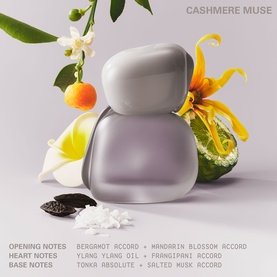 Kylie Fragrance Cashmere Muse EDP in frosted lilac bottle, surrounded by florals, citrus, and vanilla pod notes