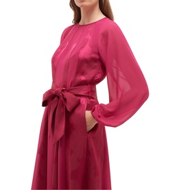 Model wearing Hobbs topaz pink midi dress with sheer long sleeves, tie waist belt, and A-line skirt