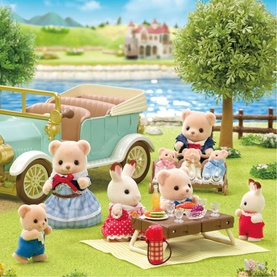Sylvanian Families bear and rabbit figures on a picnic scene with vintage car, pram, and accessories in multicolour setting