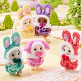 Sylvanian Families set of five small bunny figures in polka-dot costumes in multi colours including pink, blue, red, yellow and purple.