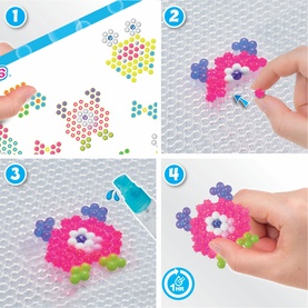 Four-step instruction guide showing colourful Aquabeads being arranged, sprayed with water, and fused into a pink flower design.