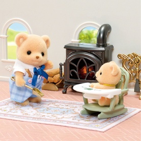 Sylvanian Families bear figures set with miniature high chair and wood-burning stove accessories on floral rug