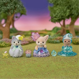 Sylvanian Families set of three dressed animal figures in multi-coloured jewel-themed outfits, displayed outdoors on grass