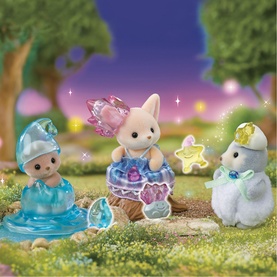 Sylvanian Families three miniature animal figures in sparkly fairy costumes on mossy woodland scene with glowing stars