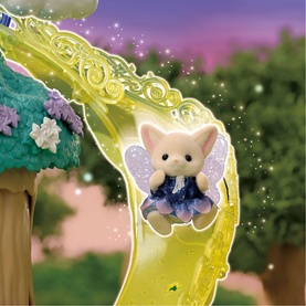 Sylvanian Families fairy cat figure with purple wings on a glittery yellow slide, set in a magical woodland scene with sparkles