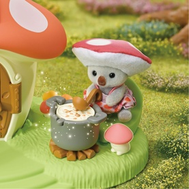 Sylvanian Families multicoloured mushroom-hatted mouse figure stirring a pot by a toadstool house, small detailed playset scene