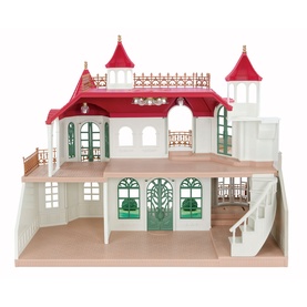 Sylvanian Families Secret Surprise Castle dollhouse with red turrets, white facade, green arched doors, balcony, and staircase