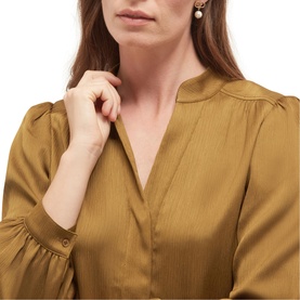 Model wearing Hobbs khaki green dress with V-neckline and billowing long sleeves with button cuffs