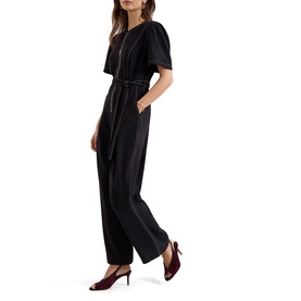 Model wearing Phase Eight black short-sleeve belted wide-leg jumpsuit, styled with burgundy heeled shoes