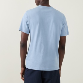 Model wearing Belstaff Phoenix Logo T-Shirt in Mist Blue, crew neck, short sleeves, rear view, styled with navy shorts.