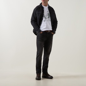 Model wearing Belstaff Blur Logo T-Shirt in white with black denim jacket, dark trousers and black boots.