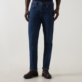 Model wearing Belstaff 3049 Straight Jeans in Washed Indigo, styled with dark brown lace-up boots.