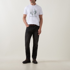 Model wearing Belstaff B69 Straight-Leg Jeans in Washed Black, styled with white graphic tee and brown leather belt.