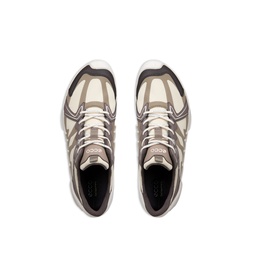 Overhead view of beige and grey chunky trainers with mesh panelling, tonal laces, and white midsole