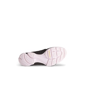 Trainer sole view showing pale pink chunky rubber outsole with tread pattern and dark upper edge visible above