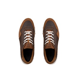 Top-down view of brown and tan leather trainers with white laces and white sole, shown as a pair
