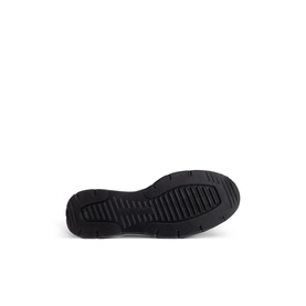 Black trainer sole with ribbed tread pattern, shown from below against white background.