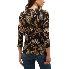 Model wearing Hobbs navy khaki floral print three-quarter sleeve top, styled with blue jeans, seen from behind.
