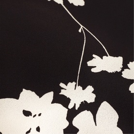 Phase Eight black and ivory floral print fabric close-up, showing large bloom and branch pattern detail.