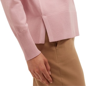 Model wearing Hobbs sweet pink knit top with ribbed cuffs, styled with camel trousers, close-up of sleeve detail