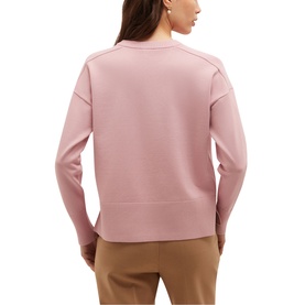 Model wearing Hobbs sweet pink crew neck sweatshirt with ribbed hem and cuffs, styled with tan trousers