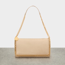 Stella McCartney Falabella butter/cream crossbody bag with gold chain trim, single shoulder strap and coin charm detail