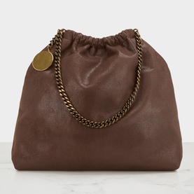 Stella McCartney crossbody bag in mahogany with gold-tone chain strap, drawstring top, and branded coin charm