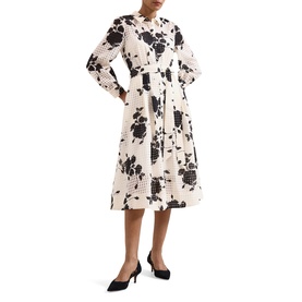 Model wearing Phase Eight black floral print midi shirt dress with belt, styled with black pointed-toe heels