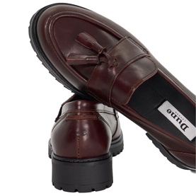 Dune burgundy leather tassel loafers with chunky black rubber sole, shown from above and side angle