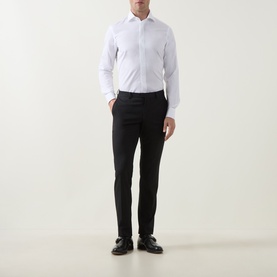 Model wearing Gherardi white cotton evening shirt with EU collar, styled with black slim-fit trousers and black leather shoes.