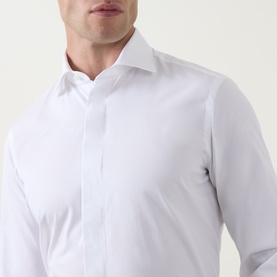 Model wearing Gherardi white cotton evening shirt, close-up of spread collar and placket front detail.