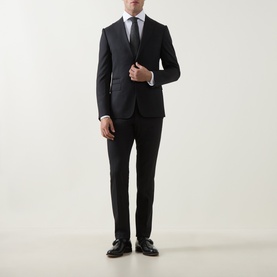 Model wearing Gherardi white cotton evening shirt styled with dark navy suit, grey tie, and black dress shoes.