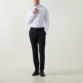 Model wearing Gherardi white single cuff regular shirt, styled with navy tailored trousers and black dress shoes