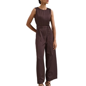Model wearing Phase Eight brown polka dot sleeveless wide-leg jumpsuit with tie waist belt and wide-leg trousers