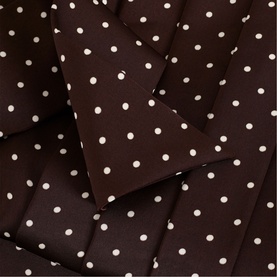 Phase Eight brown polka dot fabric detail, showing white spot print on rich dark brown woven textile