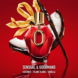 Paco Rabanne Million Red For Her Parfum, faceted red and gold bottle with bow, styled with coconut and vanilla ingredients on red background