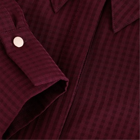 Phase Eight red woven check shirt dress, close-up of cuff with button detail and subtle tone-on-tone check fabric texture.