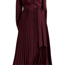 Model wearing Phase Eight red long-sleeve pleated midi dress with tie waist belt and accordion-pleated skirt
