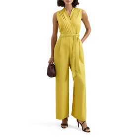 Model wearing Phase Eight yellow sleeveless wrap jumpsuit with wide-leg trousers and tie waist, styled with nude heels and brown mini bag