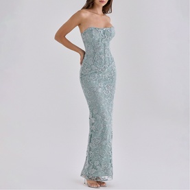 Model wearing House of CB jade strapless maxi dress with floral lace overlay and fitted mermaid silhouette