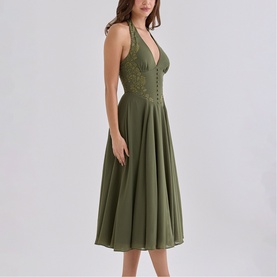 Model wearing House of CB olive halterneck midi dress with deep V-neckline, lace bodice detail and flared skirt