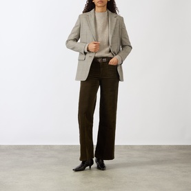 Model wearing FRAME DENIM Le Slim Palazzo Corduroy Wide-Leg Jeans in Rich Military, styled with a grey blazer and black heeled boots.