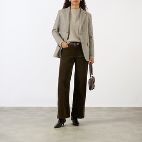 Model wearing FRAME DENIM Le Slim Palazzo Corduroy Wide-Leg Jeans in Rich Military, styled with grey blazer and black ankle boots