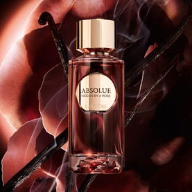 Lanc&ocirc;me Hidden By A Rose Eau De Parfum bottle with dark rose and vanilla botanical backdrop in deep crimson tones