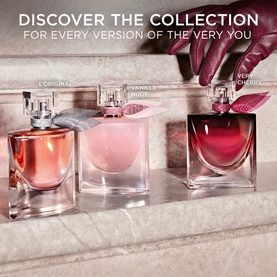 Lanc&ocirc;me La Vie Est Belle EDP collection: three bottles including L'Original, Vanille & Fleurs, and Very Cherry variants on marble surface.