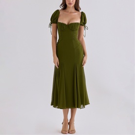 Model wearing House of CB olive midi dress with sweetheart neckline, puff sleeves with tie detail and flared skirt