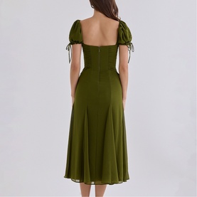 Model wearing House of CB olive midi dress with puff sleeves, tie-detail cuffs, sweetheart neckline, and A-line skirt, shown from back