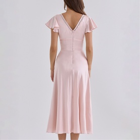 Model wearing House of CB pink midi dress with flutter sleeves, V-back neckline, and A-line skirt silhouette.