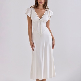 Model wearing House of CB ivory midi dress with V-neckline, flutter sleeves, tie front detail and flared skirt